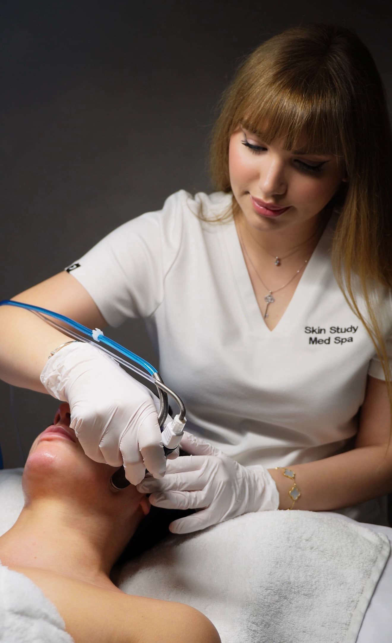 Licensed esthetician Leila Razipoor performing a treatment at Skin Study Med Spa in Plano, TX